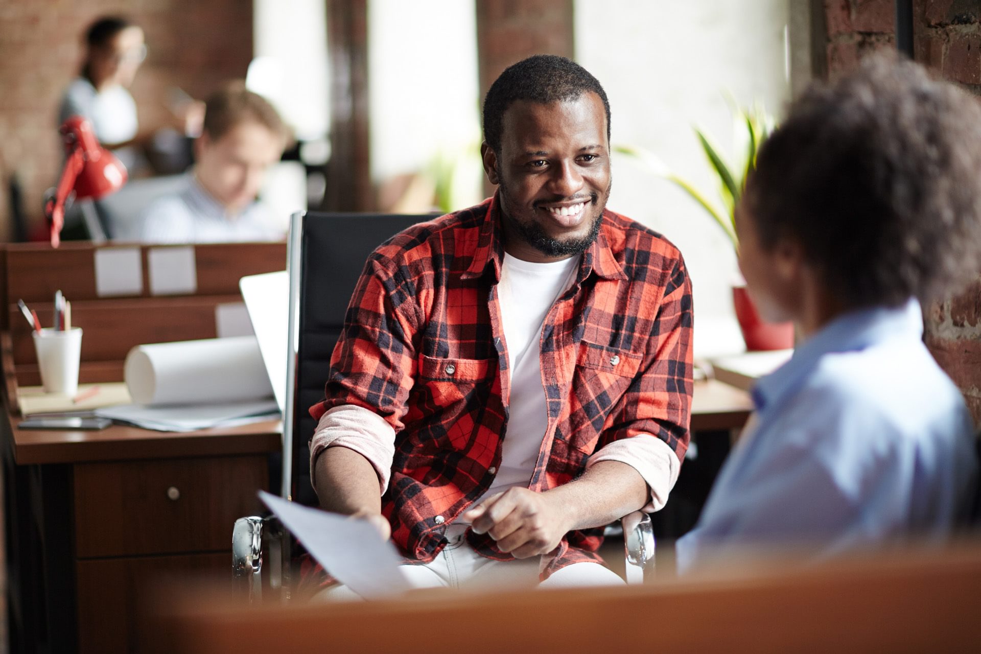 Man smiling during an interview