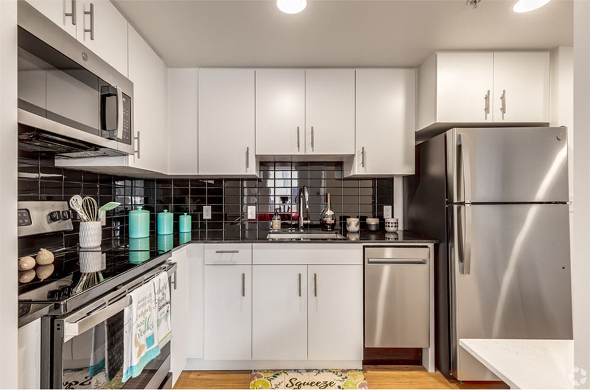 Interior view of kitchen space in luxury apartment offered by The Presley in Oklahoma City.